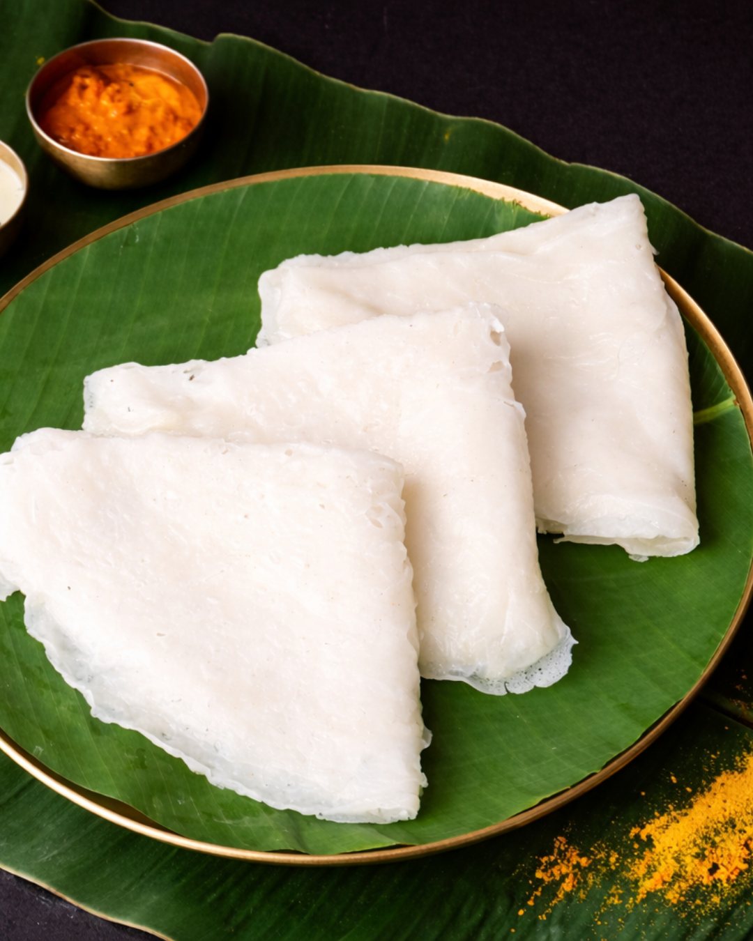 Neer dosa served on banana leaf with chutney at Anantha Veg World, Mira Road